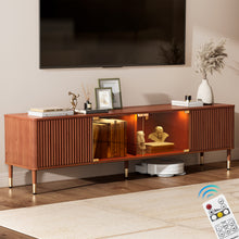 Load image into Gallery viewer, 70 Inch Fluted TV Stands for Living Room, Mid Century Modern TV Console with LED Lights and Glass Doors for TVs up to 80inch, Entertainment Center with 4 Storage Cabinets for Bedroom
